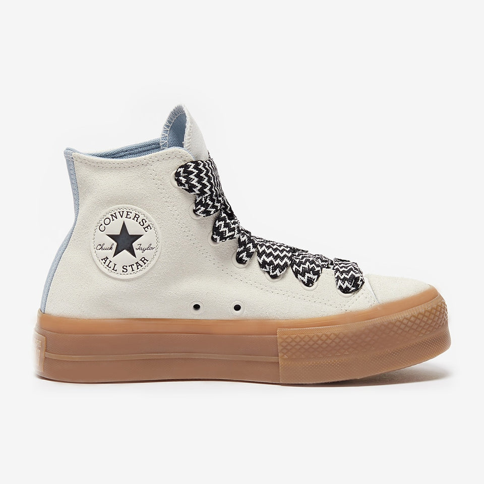 White high-top sneaker with black star logo on a white background