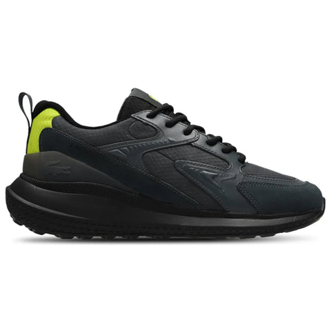 Black sneaker with a green accent on a white background