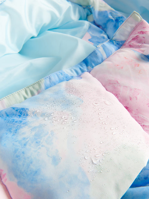 Close-up of soft, textured fabric with blue and pink colors.
