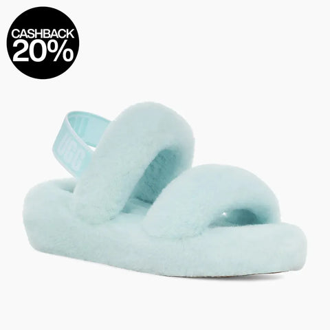 Light blue fuzzy slippers on a white background