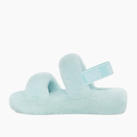 Light blue fuzzy slide sandal on a white background
