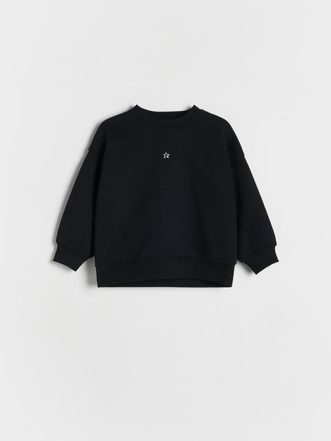 Black sweatshirt with a small white logo on a light gray background