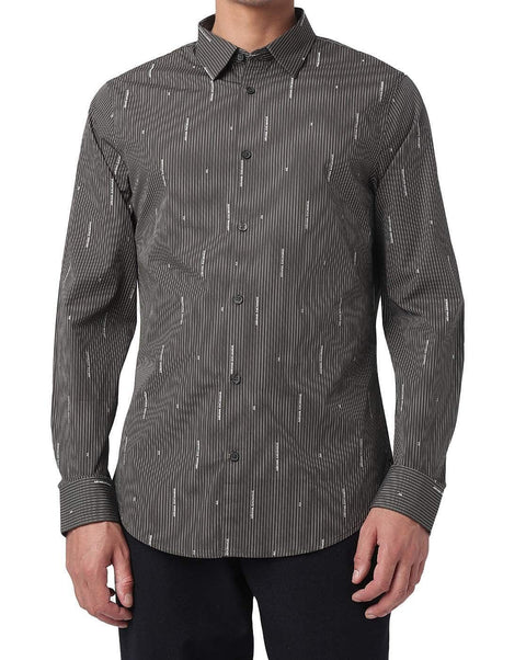 Black patterned shirt worn by a person on a white background