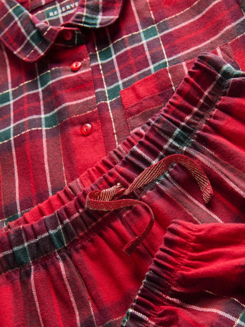 Red plaid dress with a ruffled skirt and buttons