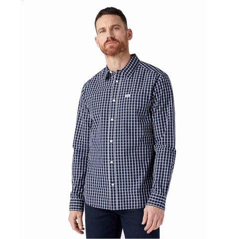 Man wearing a blue and white checkered shirt on a white background