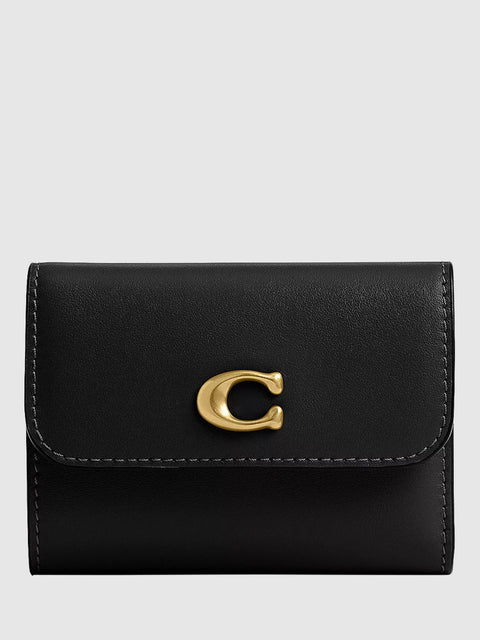 Black wallet with a gold clasp on a light gray background