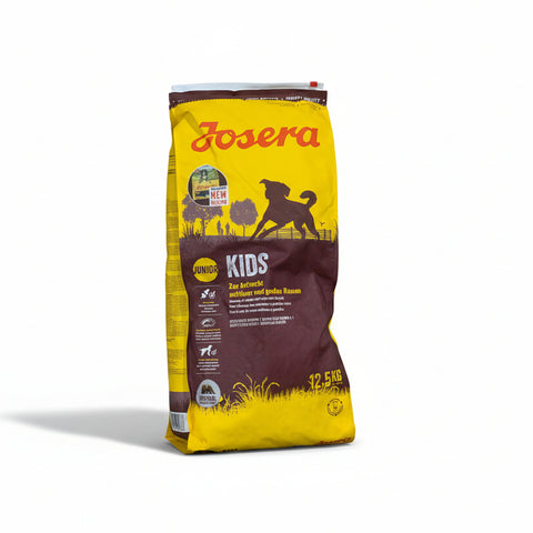 Bag of Josera Kids dog food on a concrete surface