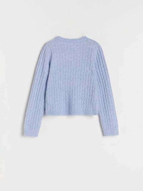 Light blue ribbed sweater on a white background
