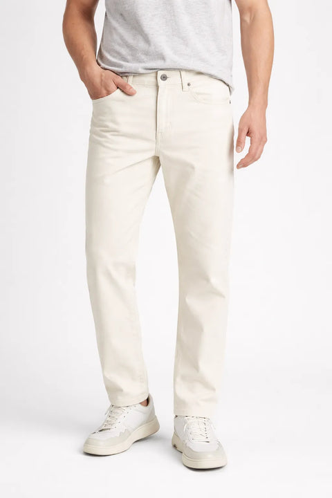Person wearing white jeans and a light gray shirt on a white background