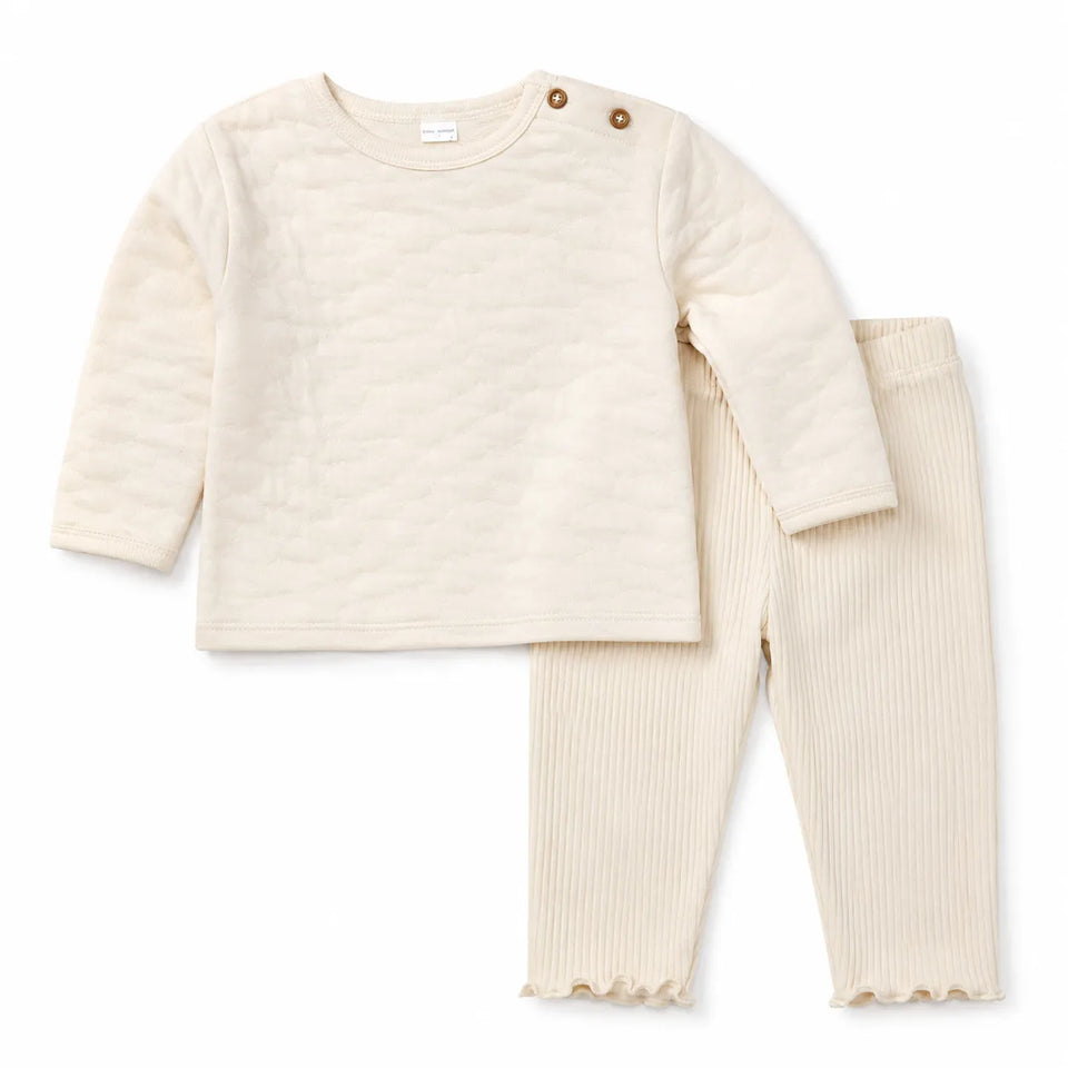 Beige baby outfit with long-sleeve top and pants on a white background