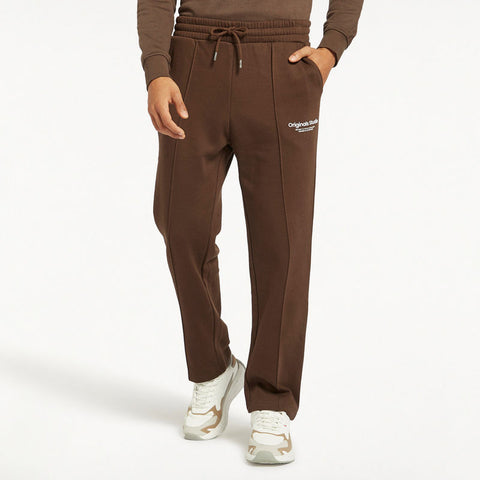Brown sweatpants with a logo on a white background