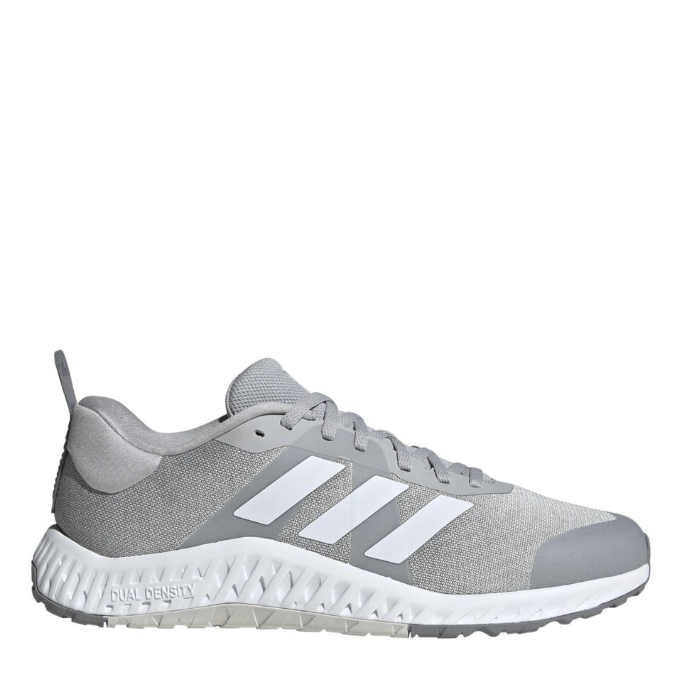 Gray Adidas running shoe with white stripes on a white background