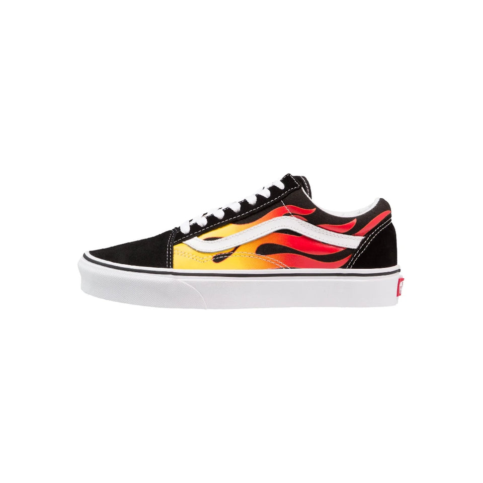 A black low-top Vans sneaker featuring a vibrant flame graphic in yellow, orange, and red on the side, with a white rubber sole and white side stripe.