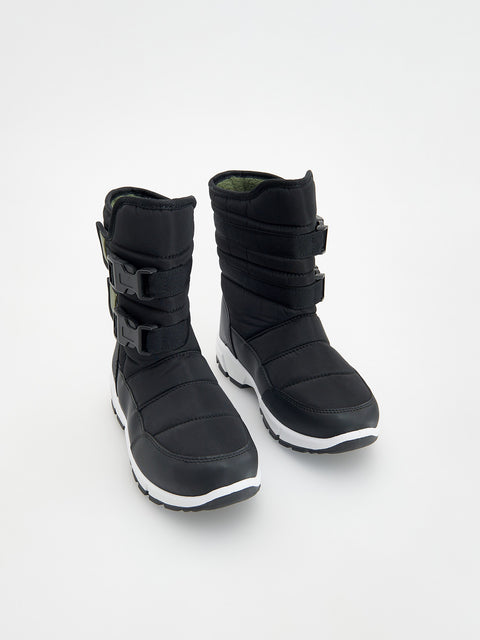 Pair of black winter boots on a white background