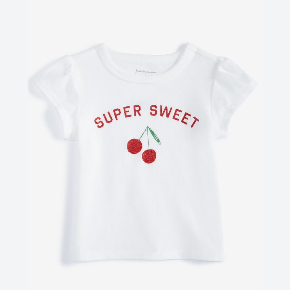 A white short-sleeve baby tee featuring the words 'SUPER SWEET' in red arched lettering above a graphic of two red cherries with green stems, displayed on a clean white background.
