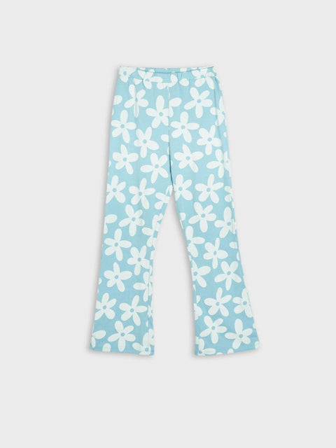 Light blue pants with white floral pattern on a light gray background