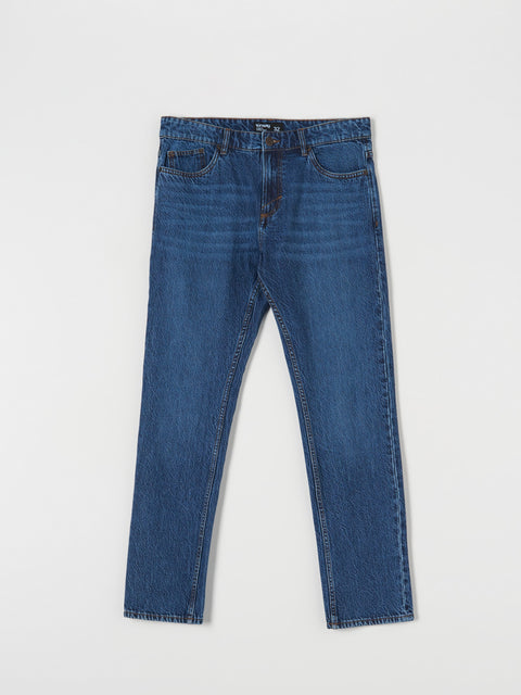 Blue jeans on a light gray background