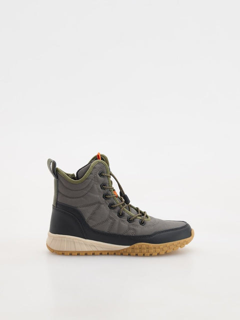 Gray and black boot with beige sole on a white background