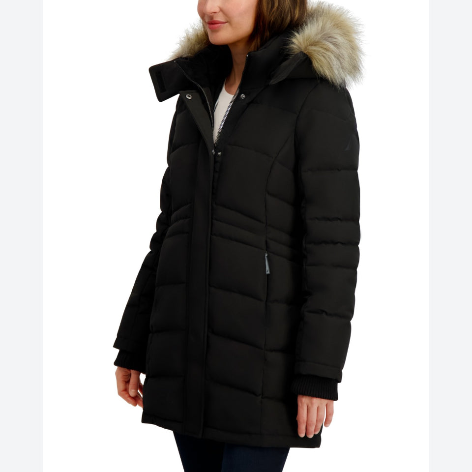 A woman wearing a black mid-length puffer parka with a faux-fur trimmed hood, shown against a plain white background.