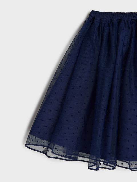 Navy blue skirt with subtle pattern on a light gray background
