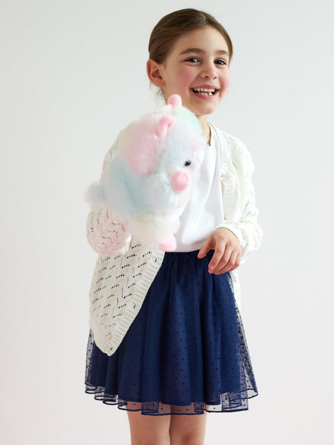 Young girl holding a plush toy with a white background