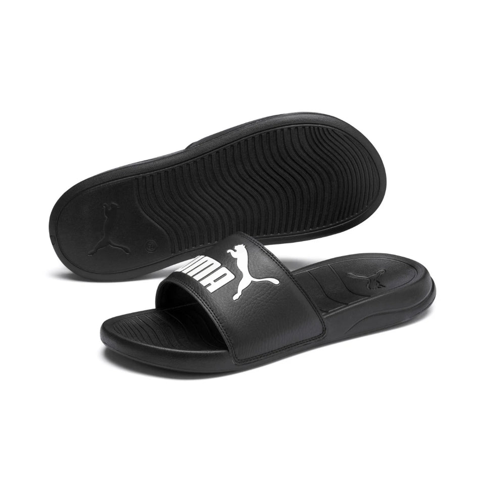 Black Puma slides on a white background