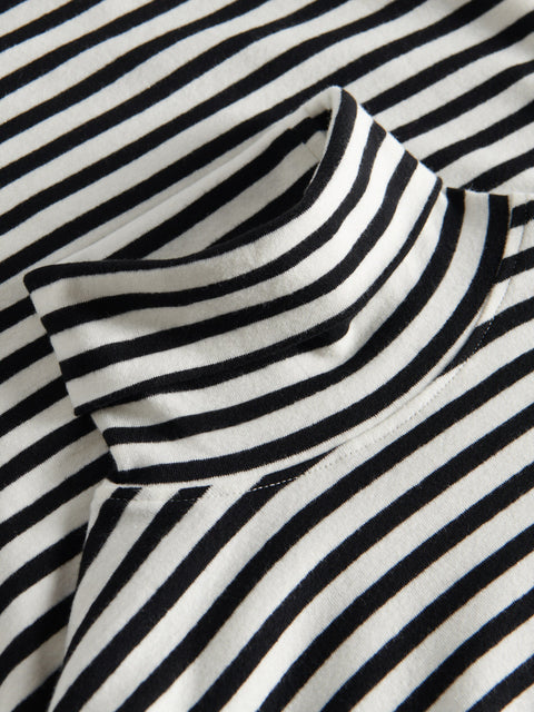 Close-up of a black and white striped fabric with a high collar.