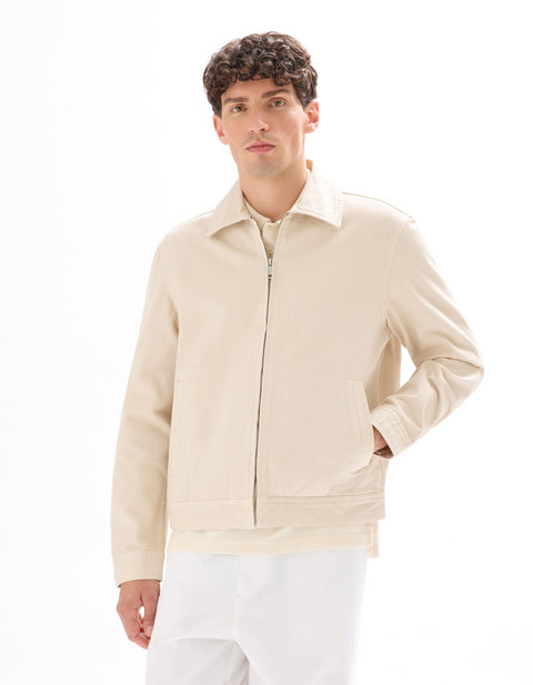 Man wearing a beige jacket on a white background