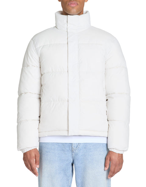 White puffer jacket worn by a person on a white background