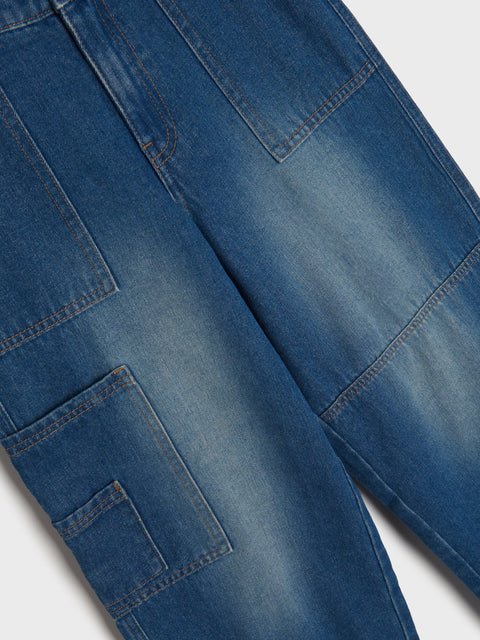 Close-up of blue jeans on a white background