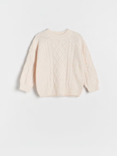 Cream-colored cable knit sweater on a light gray background