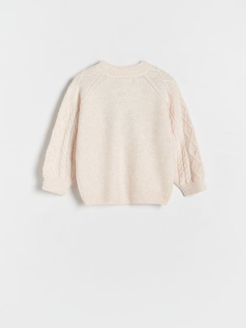 Beige sweater on a light gray background