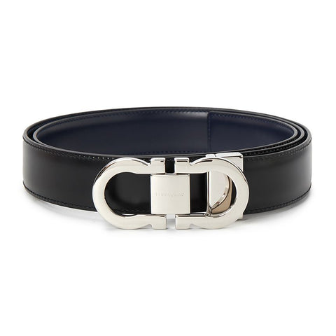 Black leather belt with silver buckle on a white background