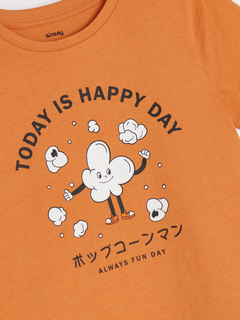 Orange t-shirt with a cloud character and text on an orange background