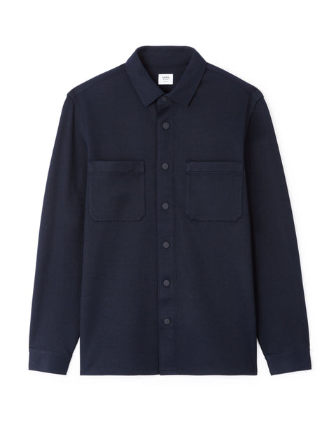 Navy blue shirt with two front pockets on a white background