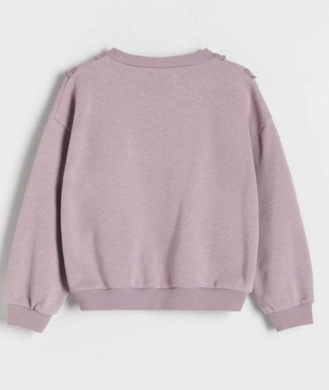 Purple sweatshirt on a light gray background