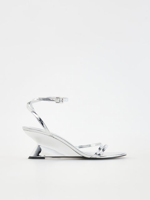 Clear high-heeled sandal on a white background