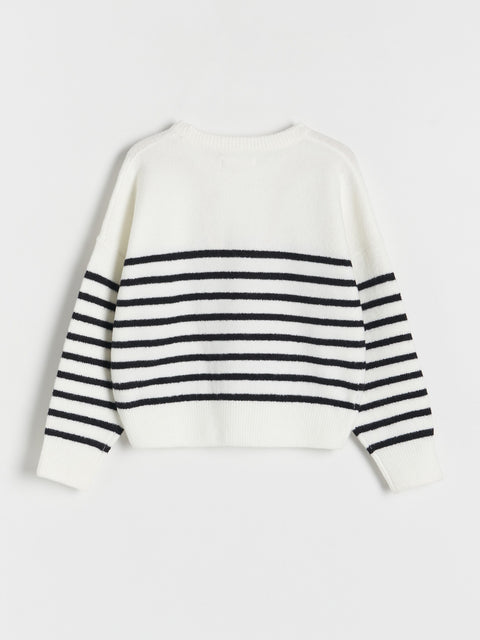 White sweater with black horizontal stripes on a light gray background