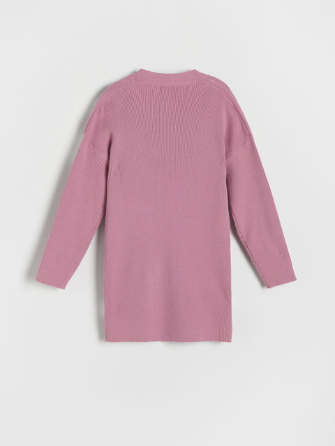 Pink sweater dress on a white background