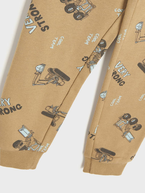 Beige pants with cartoon character and text pattern on a white background