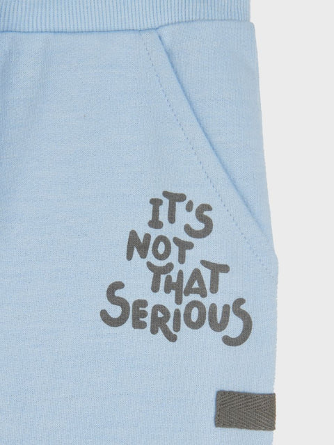 Light blue sweatshirt with 'It's not that serious' text on a white background