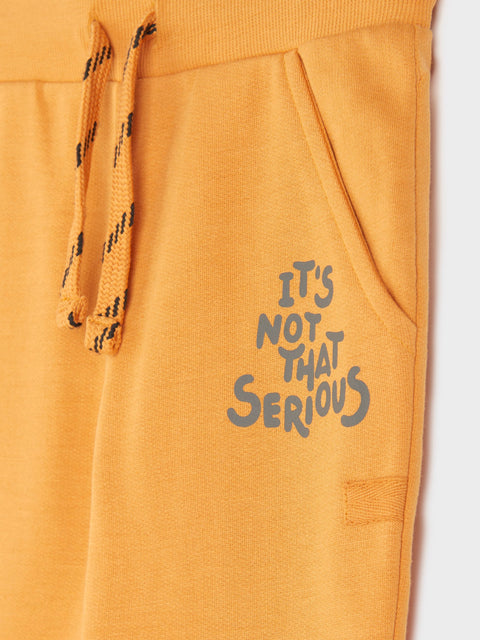 Yellow hoodie with text 'It's Not That Serious' on a white background
