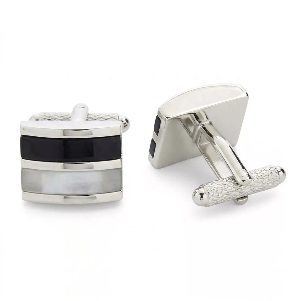 A pair of silver-toned square cufflinks with a stacked inlay design featuring black and white mother-of-pearl sections, shown on a clean white background.