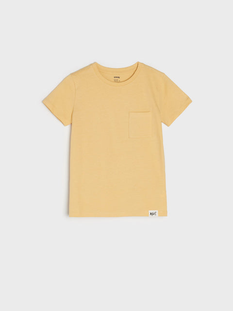 Yellow t-shirt with a pocket on a light gray background