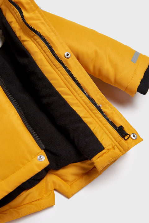 Yellow jacket with black lining on a white background