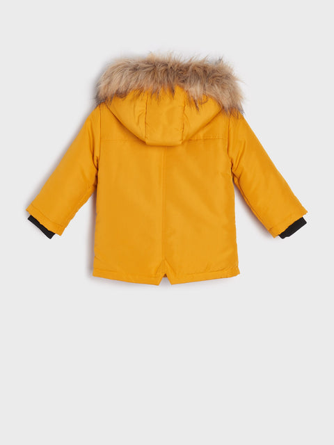 Yellow parka coat with fur hood on a white background