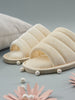 Beige slippers with pearls on a gray background
