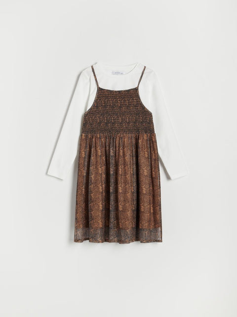 Brown patterned dress on a white background