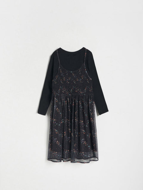 Black floral dress with long sleeves on a white background