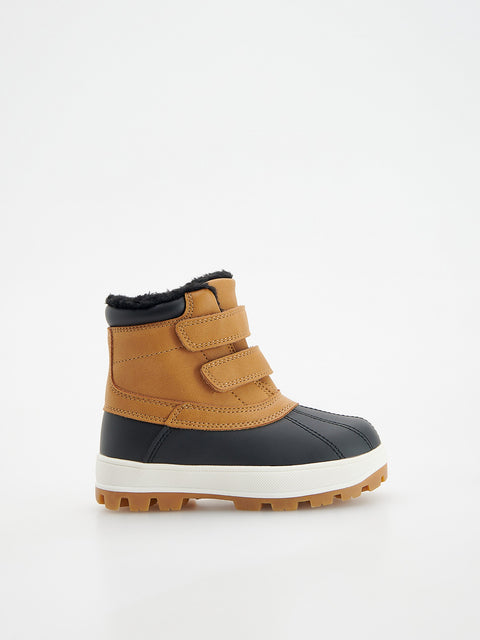 Children's winter boot with black and brown design on a white background